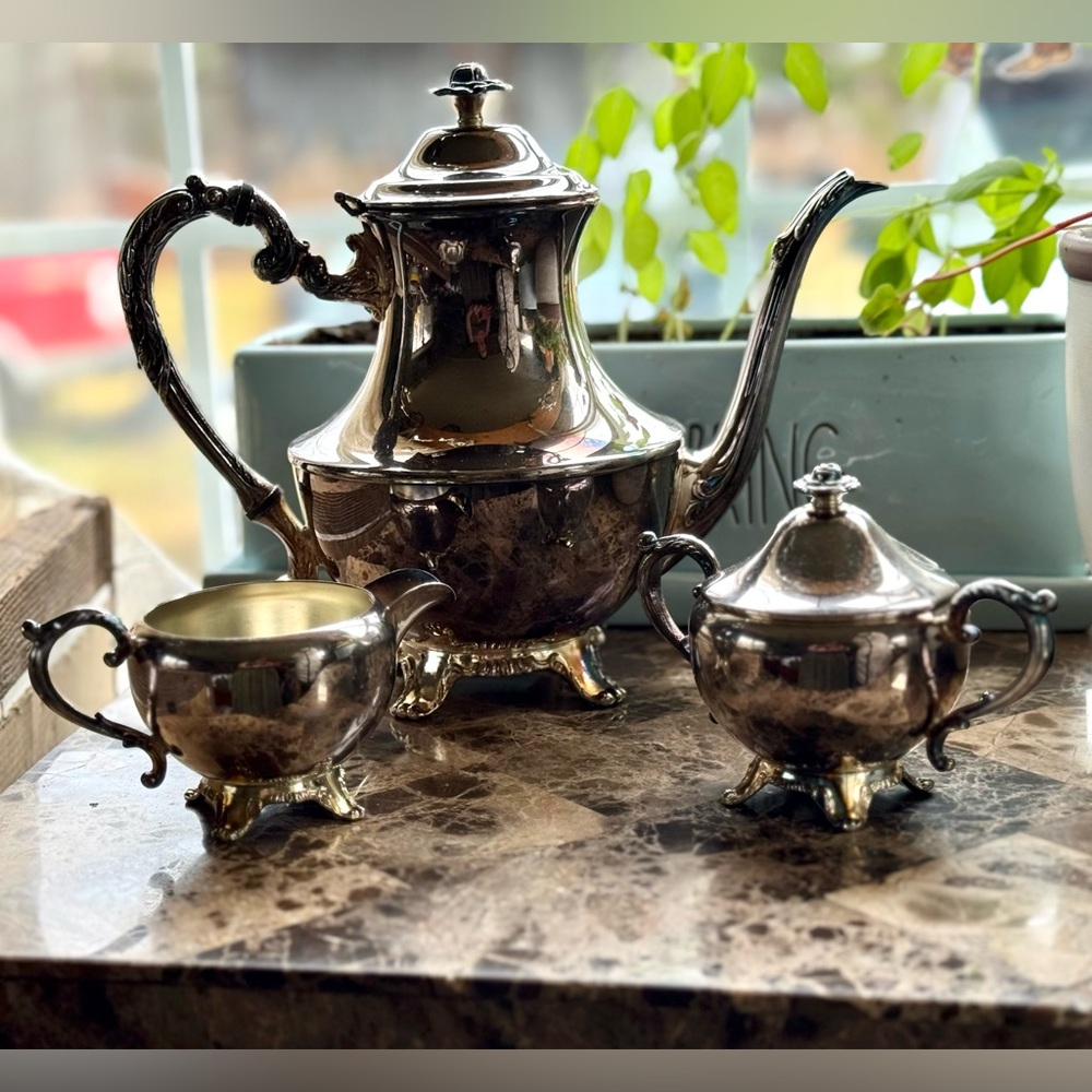Elegant Silver Tea Set with Intricate Design